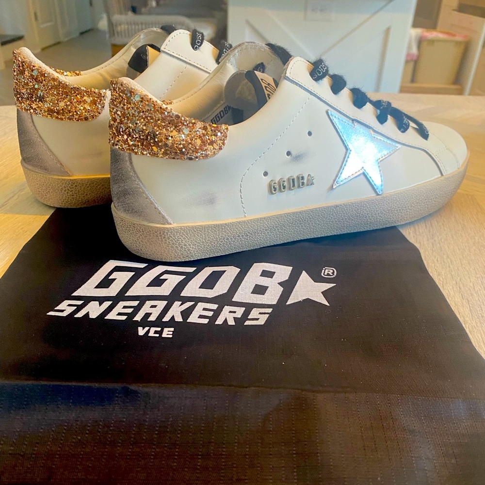 Never worn Golden Goose.White leather Super-Star sneakers with glittery heel tab